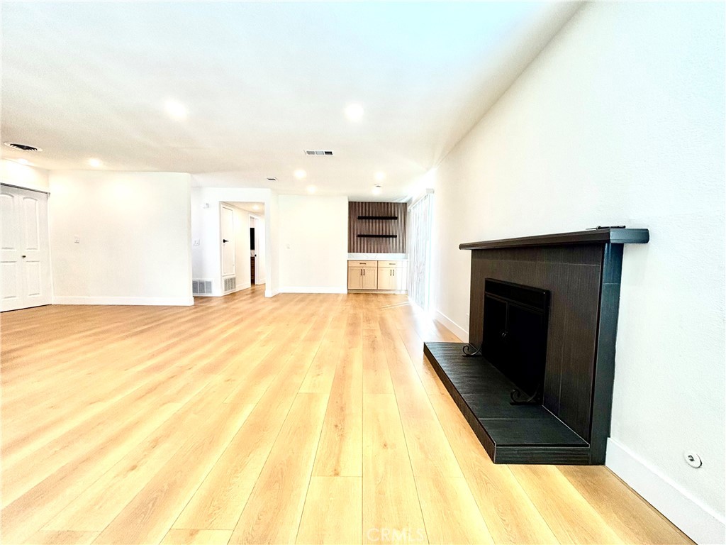 6210 Halstead Avenue, Unit A Rancho Cucamonga, CA 91701 - Photo 22 of 32 a view of a living room with a flat screen tv