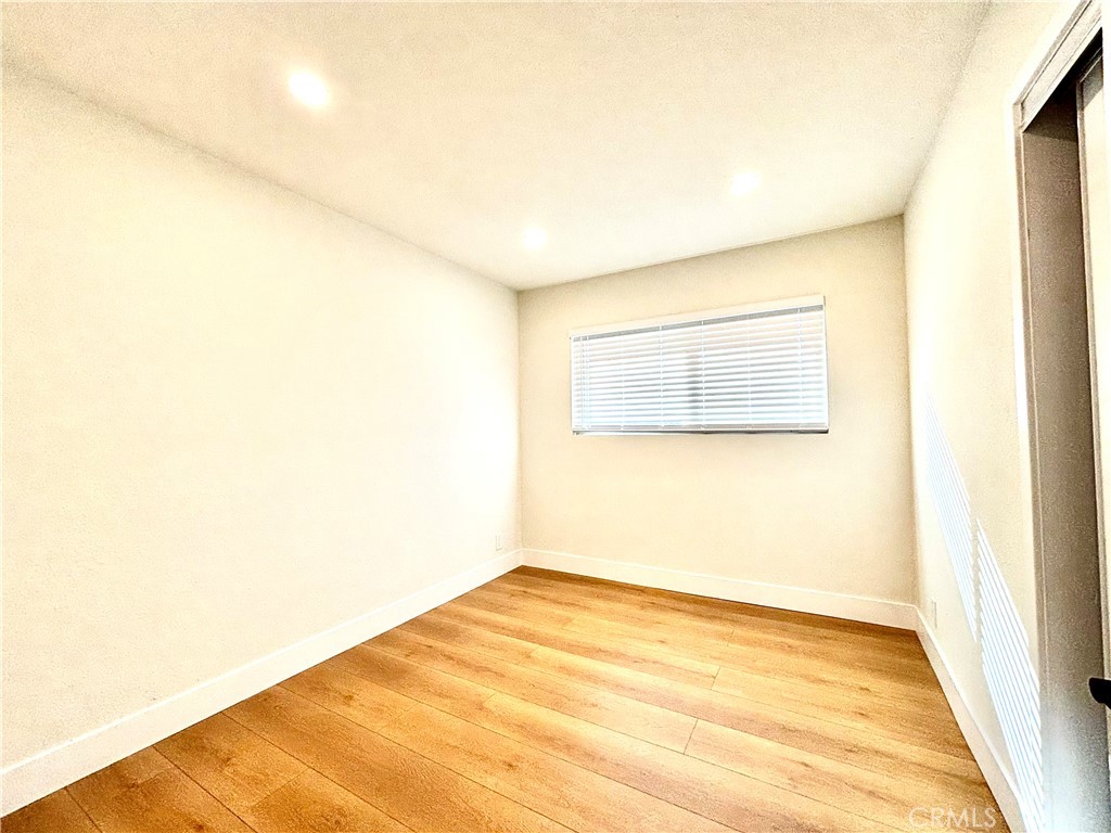 6210 Halstead Avenue, Unit A Rancho Cucamonga, CA 91701 - Photo 32 of 32 a view of empty room with wooden floor and fan