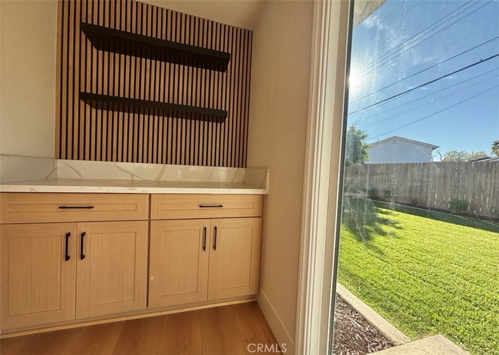 6210 Halstead Avenue, Unit A Rancho Cucamonga, CA 91701 - Photo 6 of 32 a view of a kitchen from a corridor
