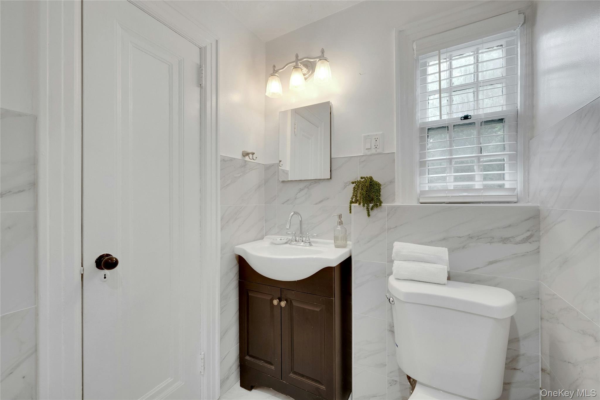 1179 Post Road Scarsdale, NY 10583 - Photo 12 of 24 Hall bathroom with standing shower with glass doors.