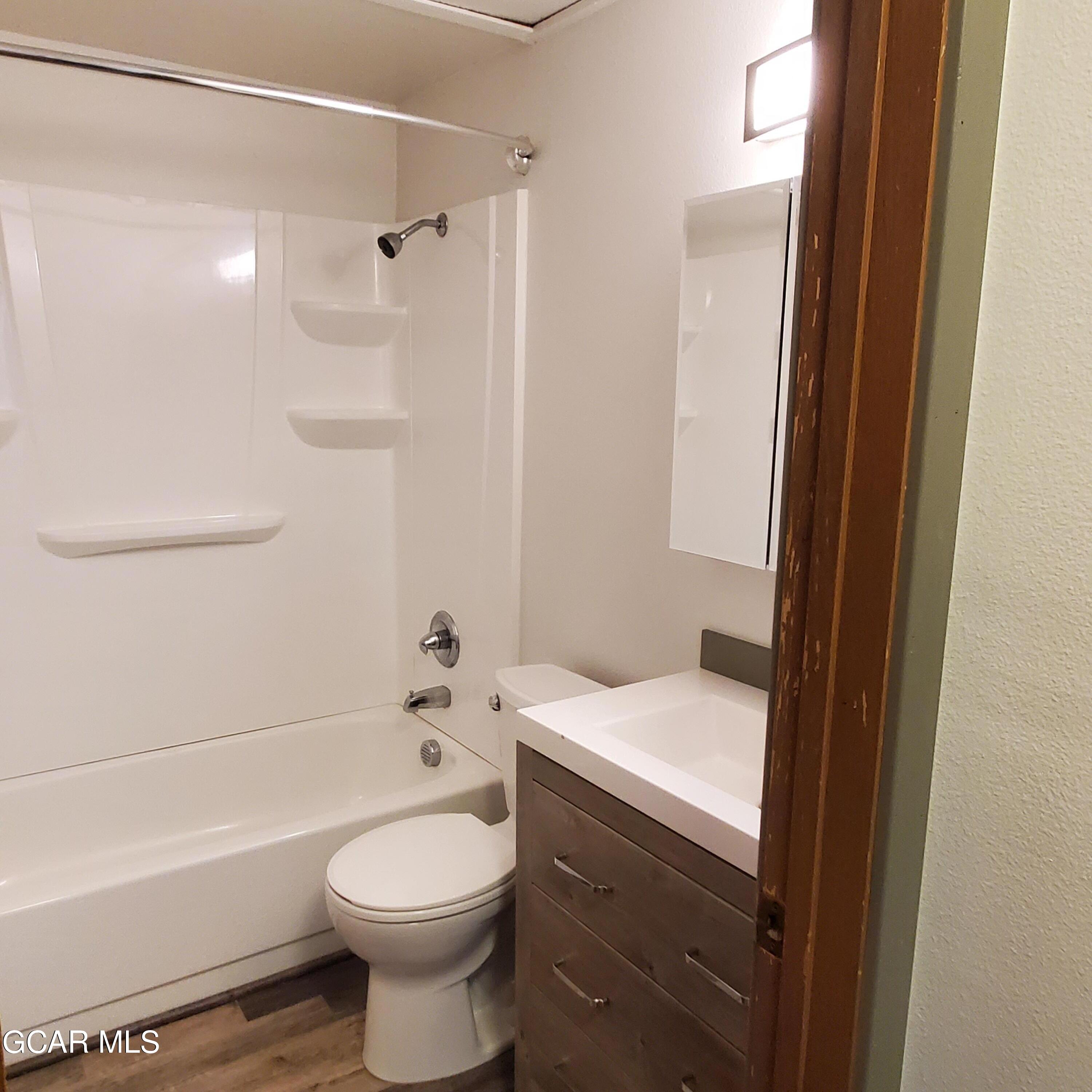 225 Carriage Road Fraser, CO 80442 - Photo 11 of 11 a bathroom with a sink a toilet and shower