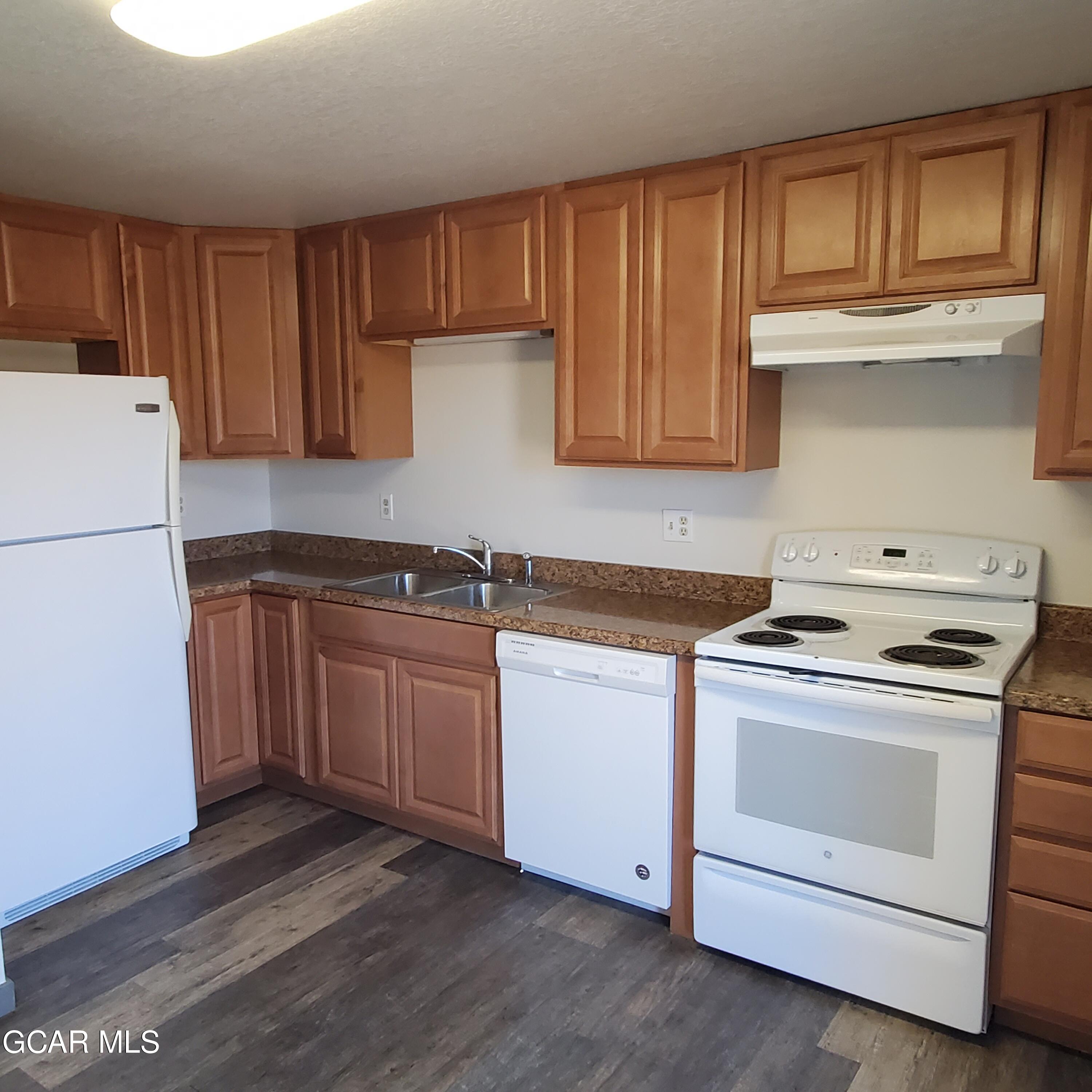 225 Carriage Road Fraser, CO 80442 - Photo 5 of 11 a kitchen with sink a stove and cabinets