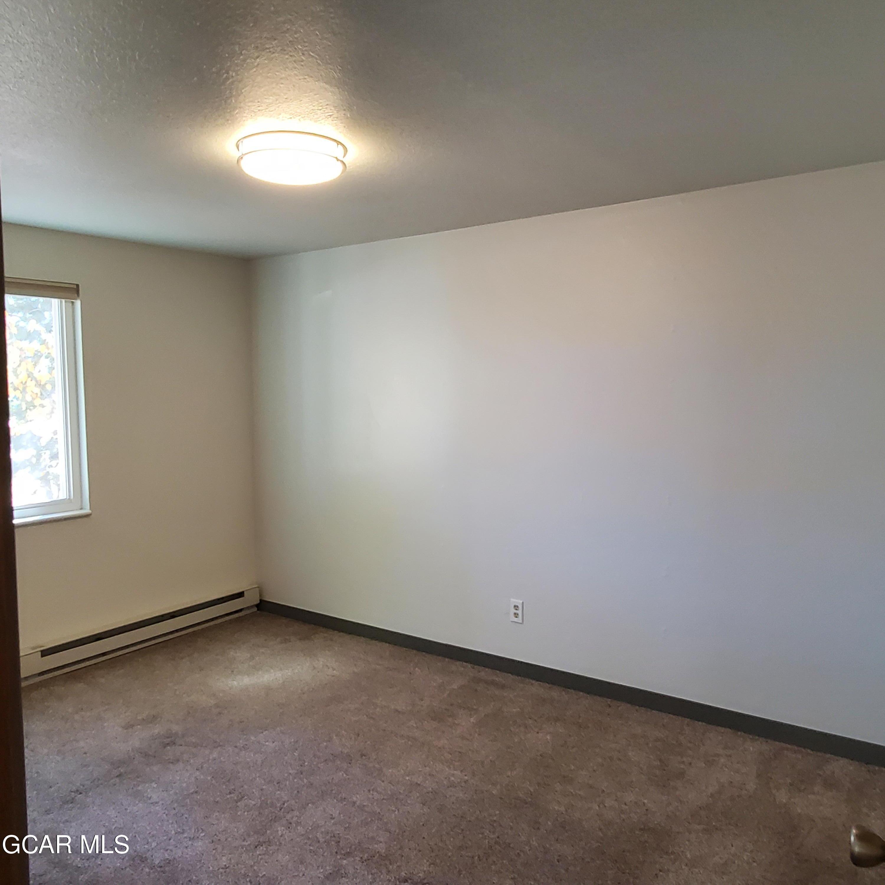 225 Carriage Road Fraser, CO 80442 - Photo 8 of 11 an empty room with a empty space and windows
