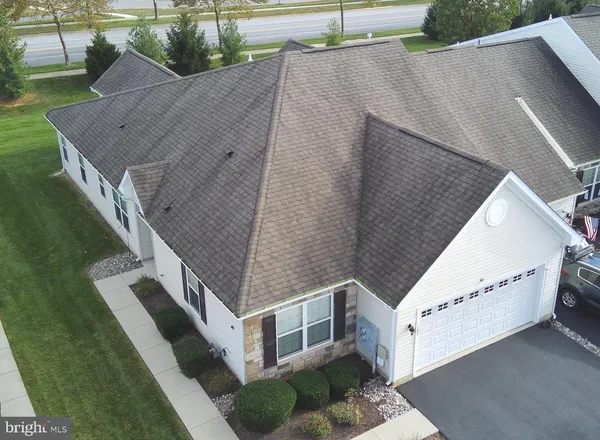 a aerial view of a house with a yard