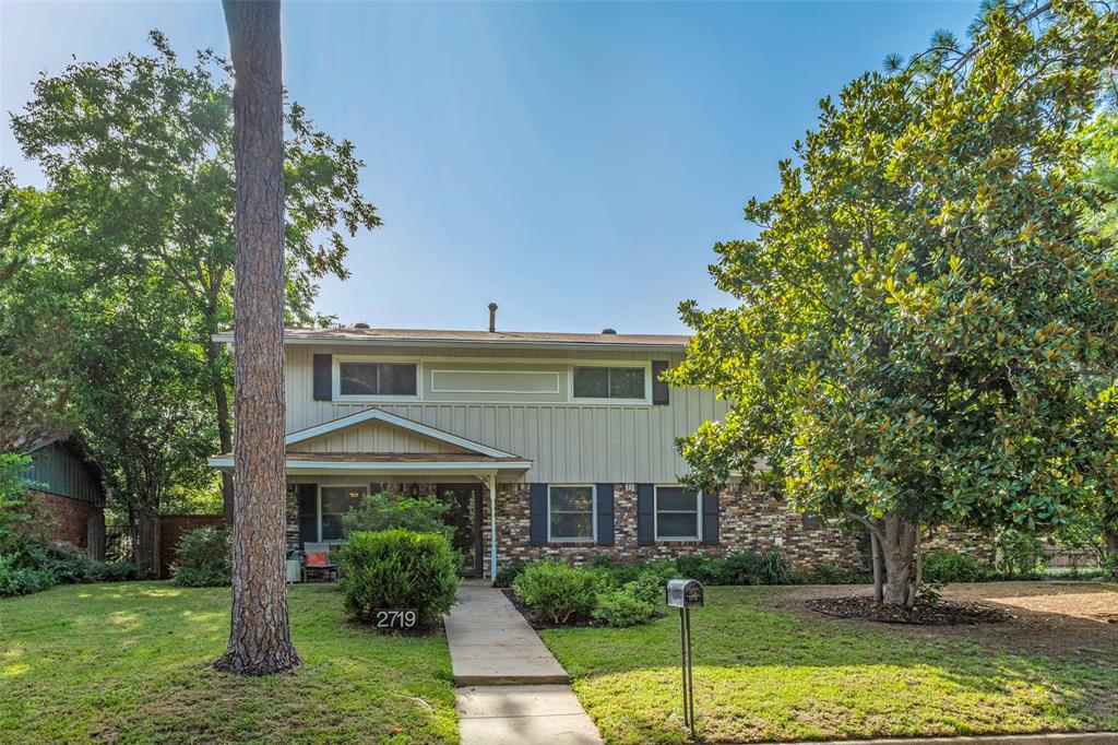 2719 Northcrest Road Denton, TX 76209 - Photo 1 of 1 a front view of a house with garden