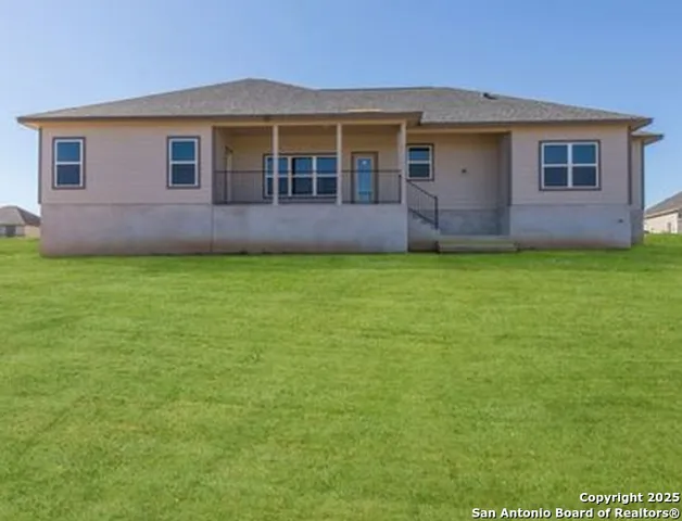 a front view of a house with yard