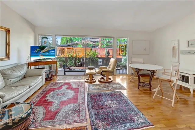 a living room with furniture and a rug