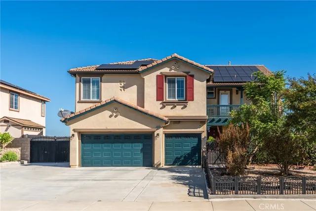 a front view of a house with a garage