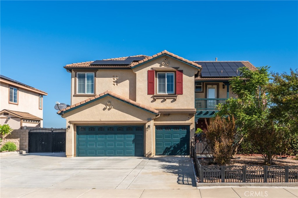 a front view of a house with a garage