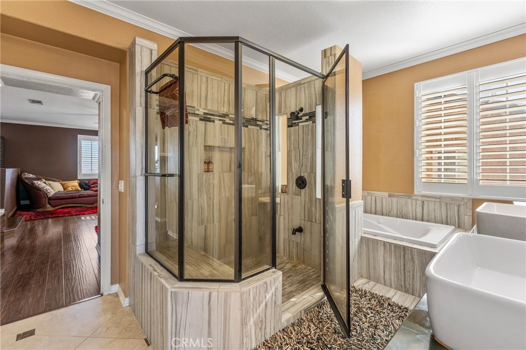 18458 Hidden Ranch Road Riverside, CA 92508 - Photo 15 of 30 a bathroom with a shower and a tub