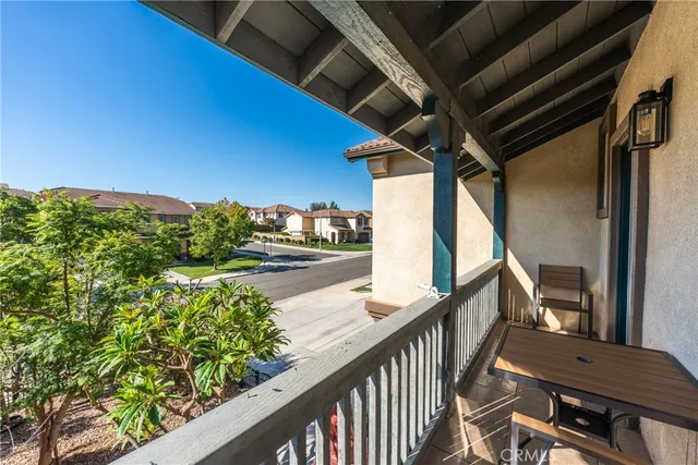 a view of balcony with wooden floor
