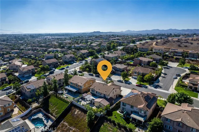 an aerial view of a house with a swimming pool