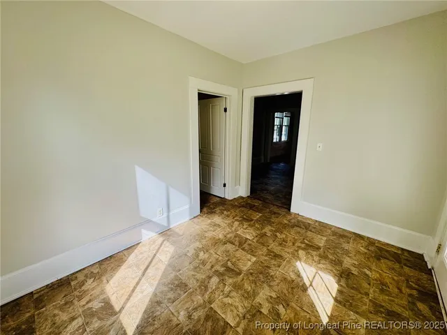 a view of a big room with closet and wooden floor