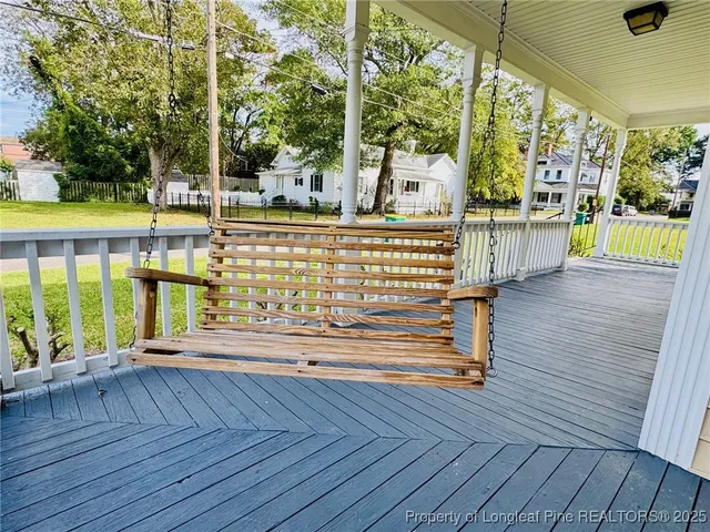 a view of balcony with wooden floor