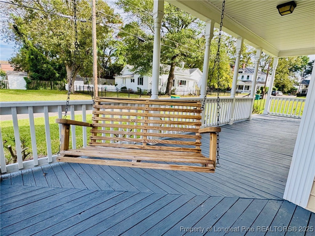 907 Caldwell Street, Unit A Lumberton, NC 28358 - Photo 19 of 24 a view of balcony with wooden floor
