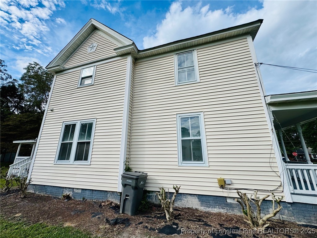 907 Caldwell Street, Unit A Lumberton, NC 28358 - Photo 20 of 24 a view of a house with a yard and stairs