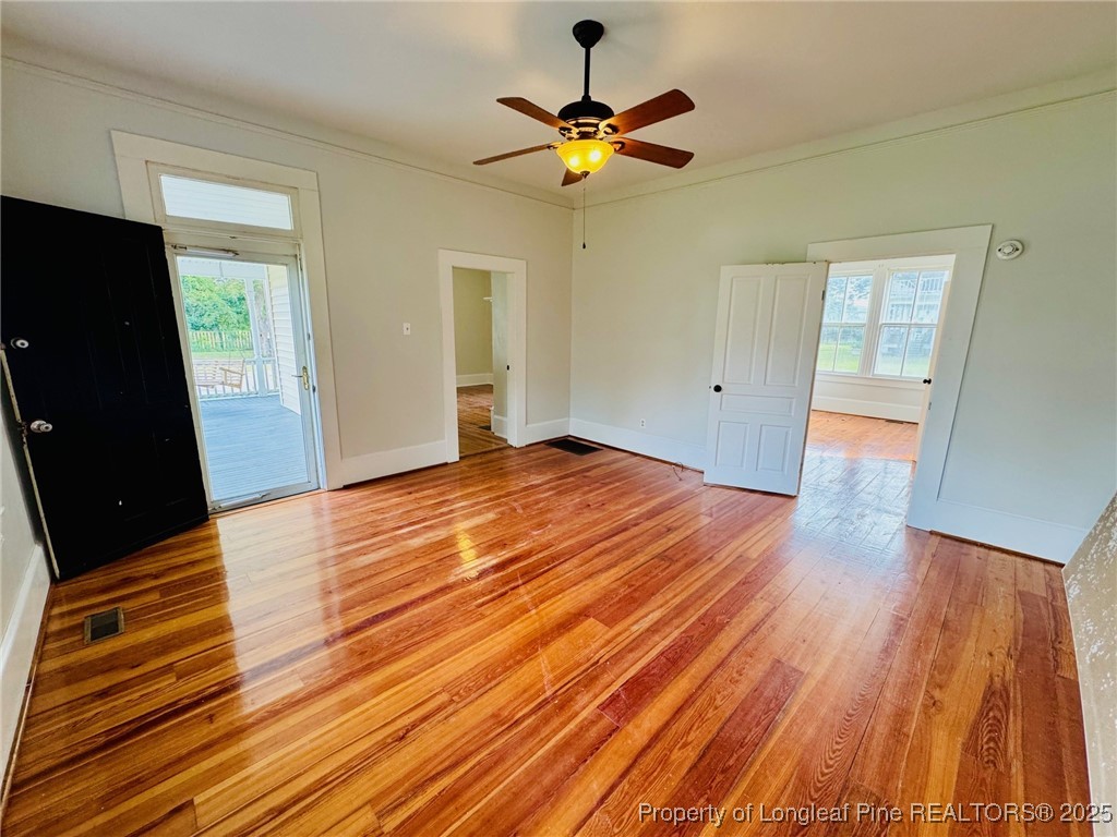 907 Caldwell Street, Unit A Lumberton, NC 28358 - Photo 5 of 24 a view of an empty room with wooden floor