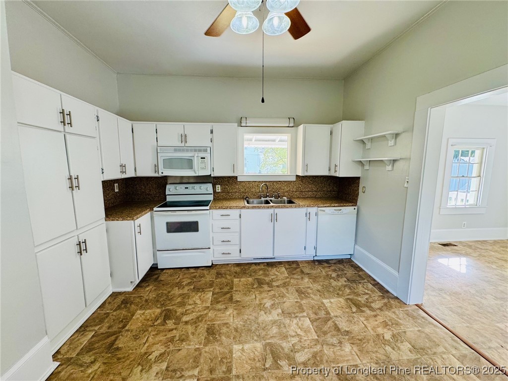907 Caldwell Street, Unit A Lumberton, NC 28358 - Photo 7 of 24 a kitchen with granite countertop a refrigerator and a stove