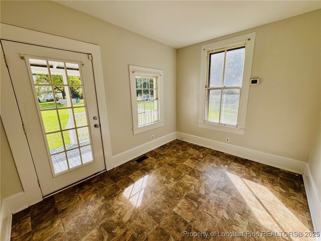 907 Caldwell Street, Unit A Lumberton, NC 28358 - Photo 10 of 24 a view of an empty room and window