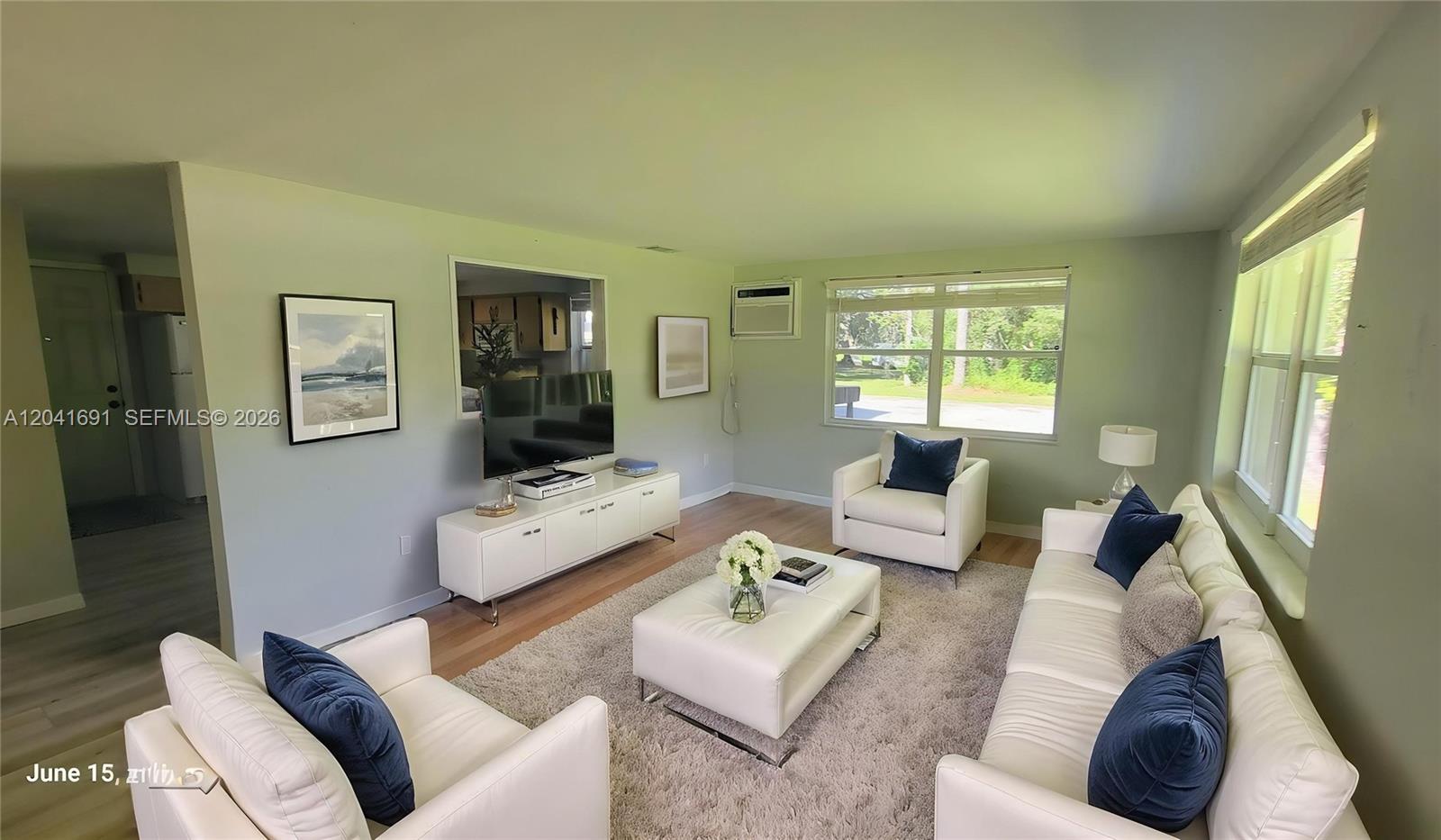1270 Nobles Road LaBelle, FL 33935 - Photo 9 of 18 a living room with furniture and a large window