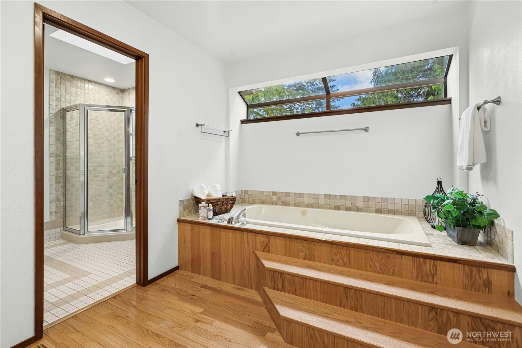 5211 103rd Street Southwest, Unit SW Mukilteo, WA 98275 - Photo 21 of 40 a bathroom with a tub and shower