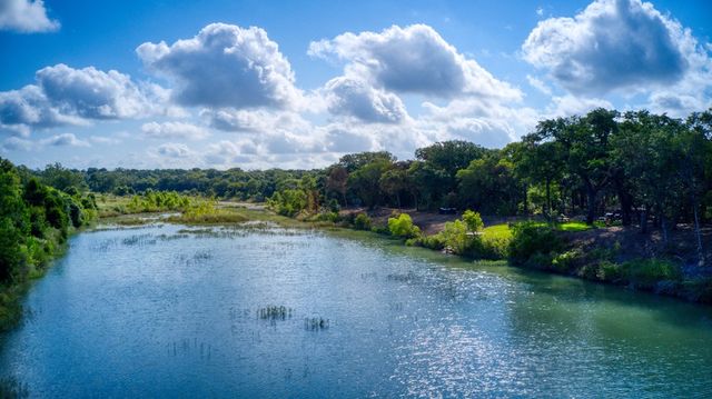 a view of a city with lush green forest