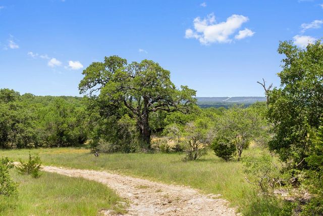 a view of a lake with a yard