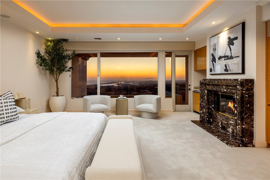 3 Seashell Newport Coast, CA 92657 - Photo 15 of 36 a large bedroom with a large bed and a large window with outer view