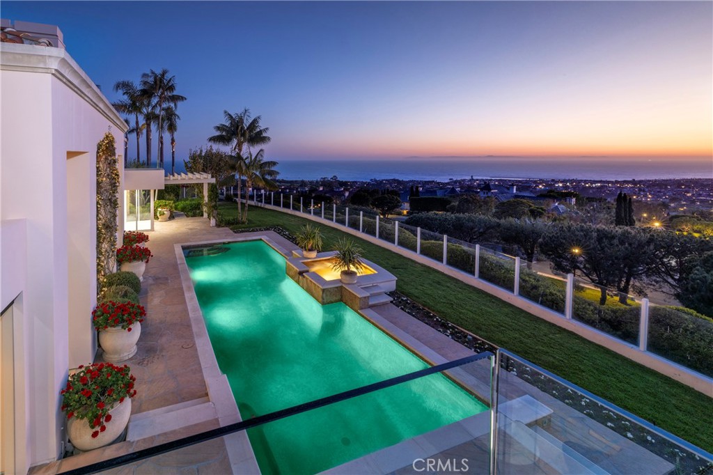 3 Seashell Newport Coast, CA 92657 - Photo 17 of 36 a view of a swimming pool with a seating space