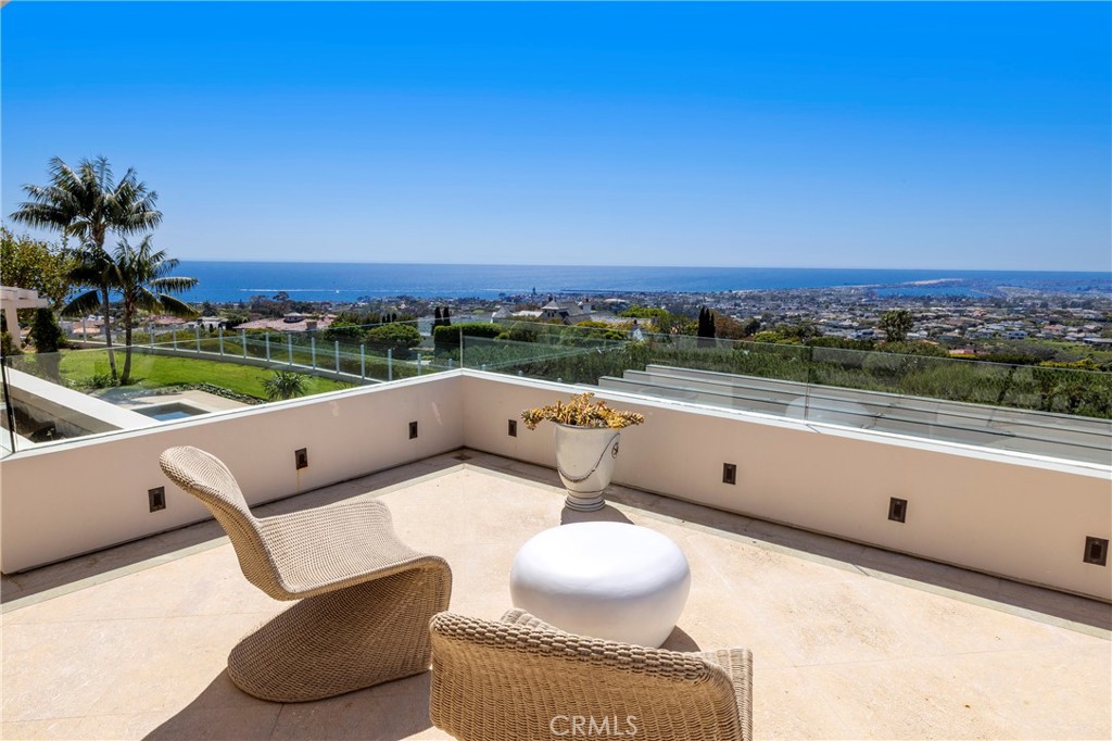 3 Seashell Newport Coast, CA 92657 - Photo 18 of 36 a view of roof deck with seating space and mountain view in back