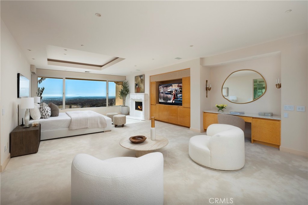 3 Seashell Newport Coast, CA 92657 - Photo 20 of 36 a living room with furniture a mirror and a large window
