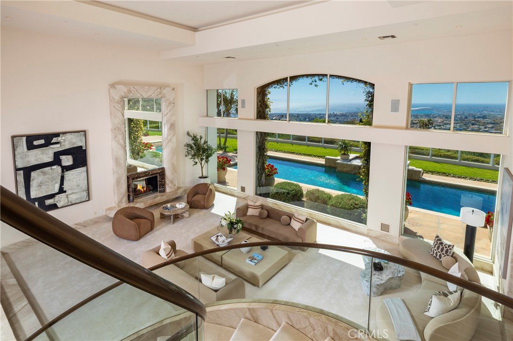 3 Seashell Newport Coast, CA 92657 - Photo 23 of 36 a living room with furniture and a flat screen tv