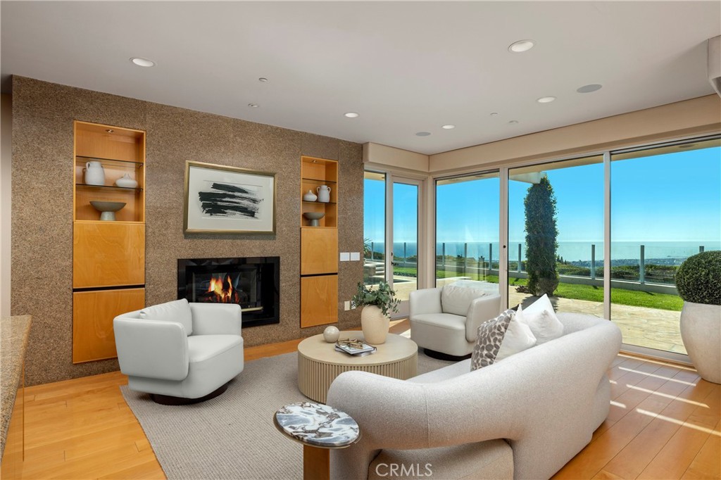 3 Seashell Newport Coast, CA 92657 - Photo 28 of 36 a living room with furniture and a fireplace
