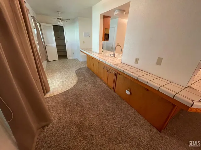 a bathroom with a double vanity sink and mirror