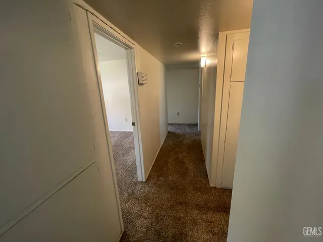 a bathroom with a shower and a mirror