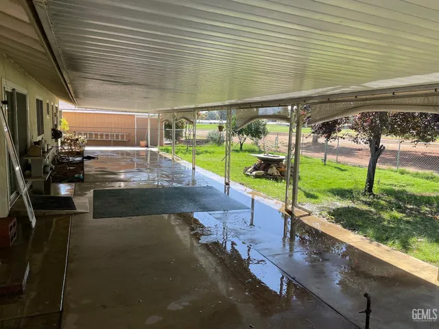 a view of a backyard of the house