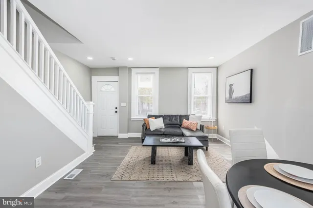 a living room with furniture and a rug