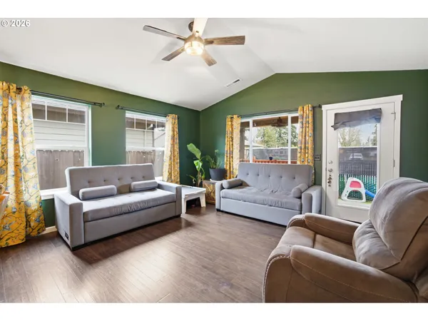 a living room with furniture and a large window