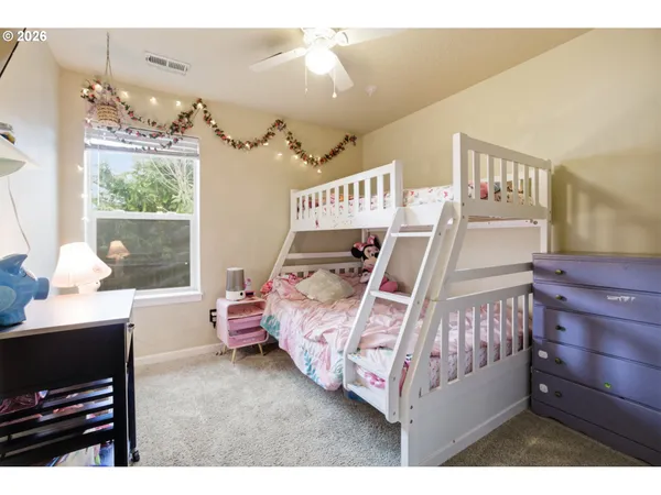 a bed room with a bed and a window