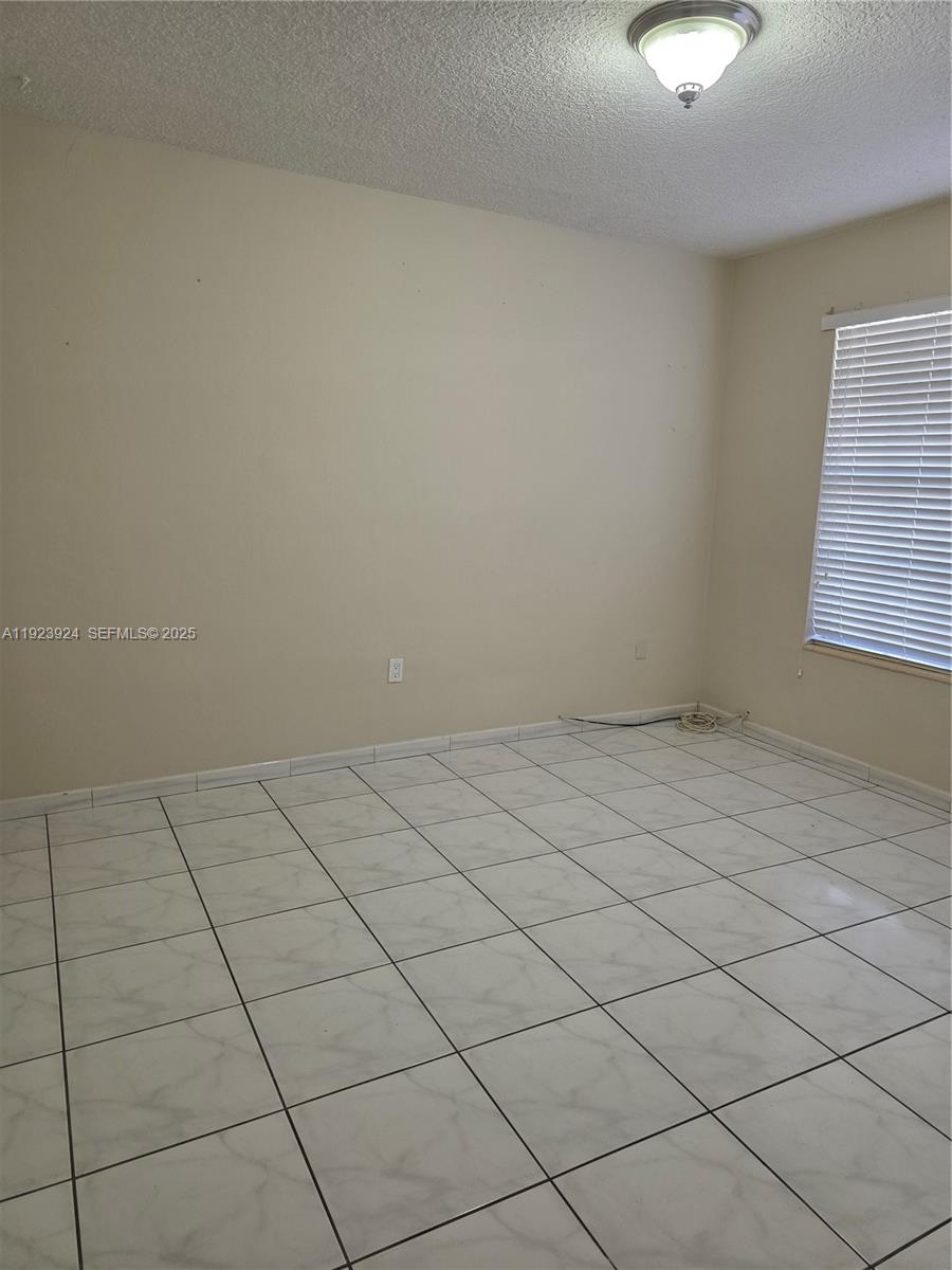 1560 West 53rd Terrace, Unit 1560 Hialeah, FL 33012 - Photo 21 of 28 a view of a room and utility