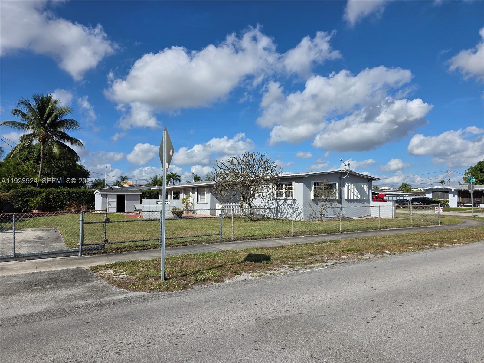 1560 West 53rd Terrace, Unit 1560 Hialeah, FL 33012 - Photo 5 of 28 a view of a fountain in front of a house