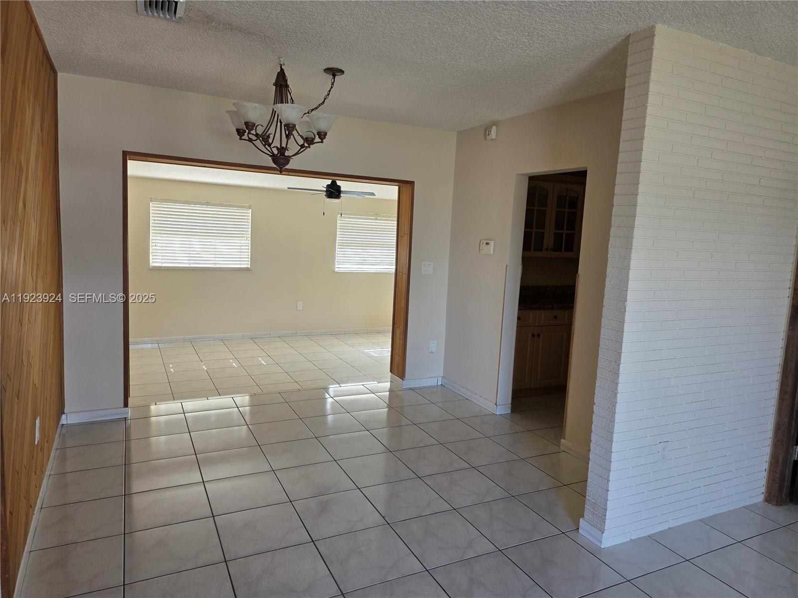 1560 West 53rd Terrace, Unit 1560 Hialeah, FL 33012 - Photo 8 of 28 a view of a hallway