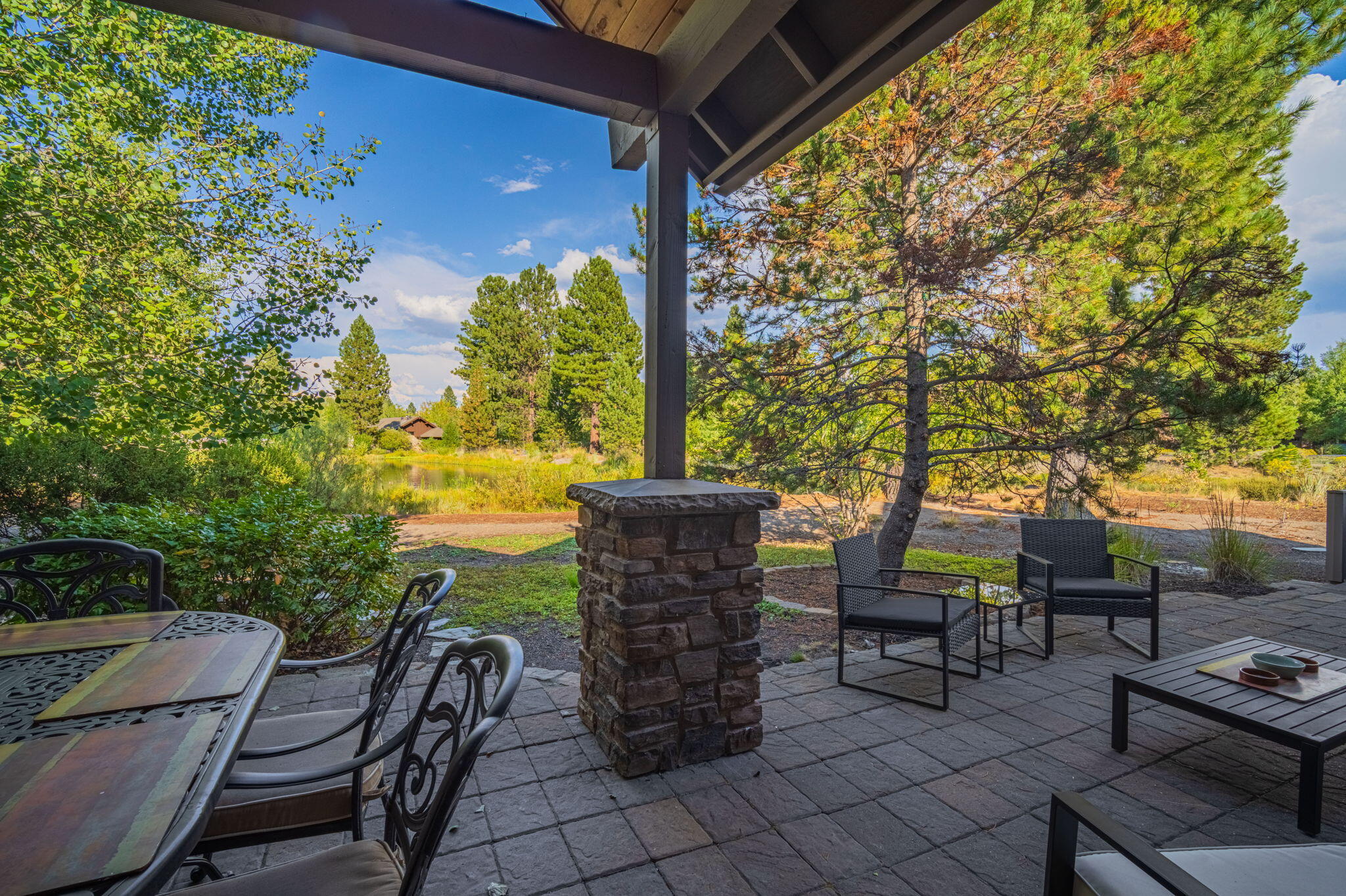 56508 Dancing Rock Loop, Unit 22 Bend, OR 97707 - Photo 44 of 69 a view of a chairs and table in patio