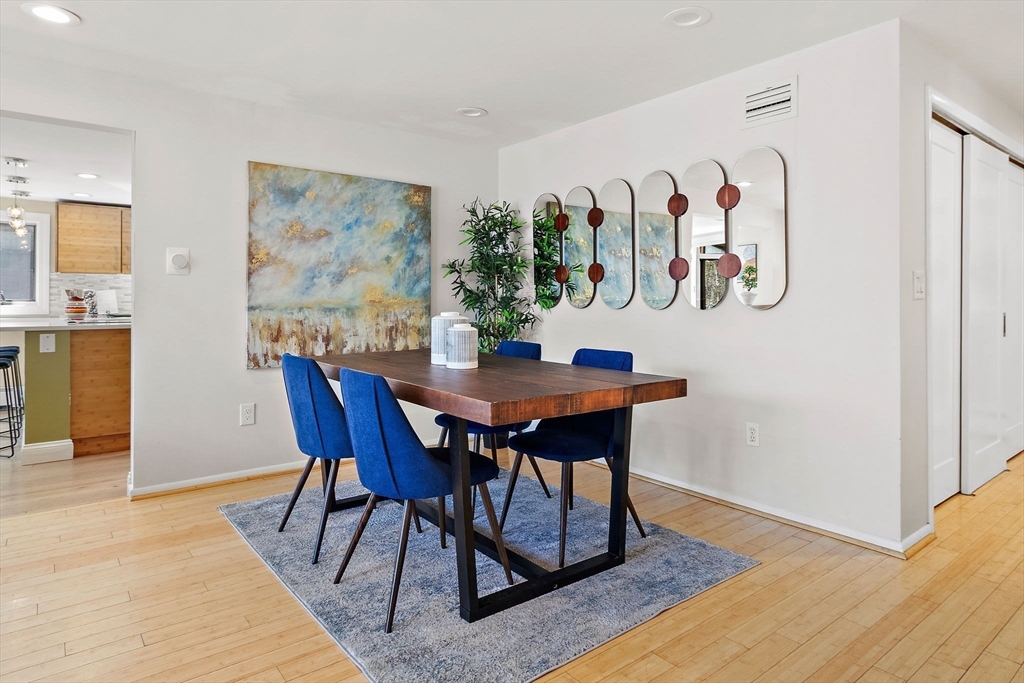 33 Turning Mill Road Lexington, MA 02420 - Photo 11 of 42 a view of a dining room with furniture and wooden floor