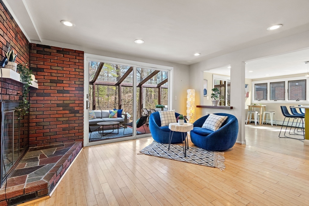33 Turning Mill Road Lexington, MA 02420 - Photo 12 of 42 a living room with fireplace furniture and a large window
