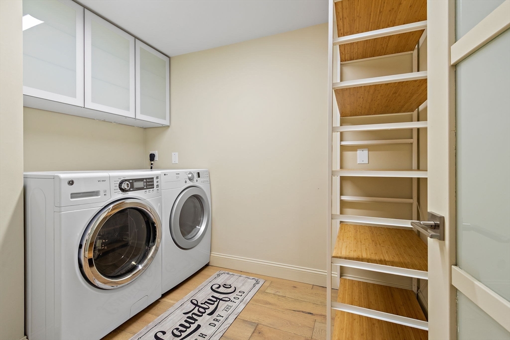 33 Turning Mill Road Lexington, MA 02420 - Photo 19 of 42 a storage room with washer and dryer