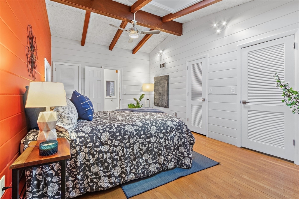 33 Turning Mill Road Lexington, MA 02420 - Photo 22 of 42 a bed sitting in a spacious bedroom next to a window