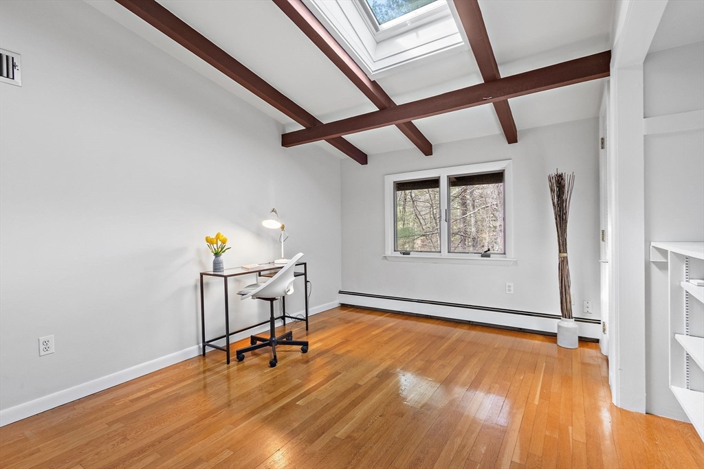33 Turning Mill Road Lexington, MA 02420 - Photo 29 of 42 a view of an empty room with a window and wooden floor