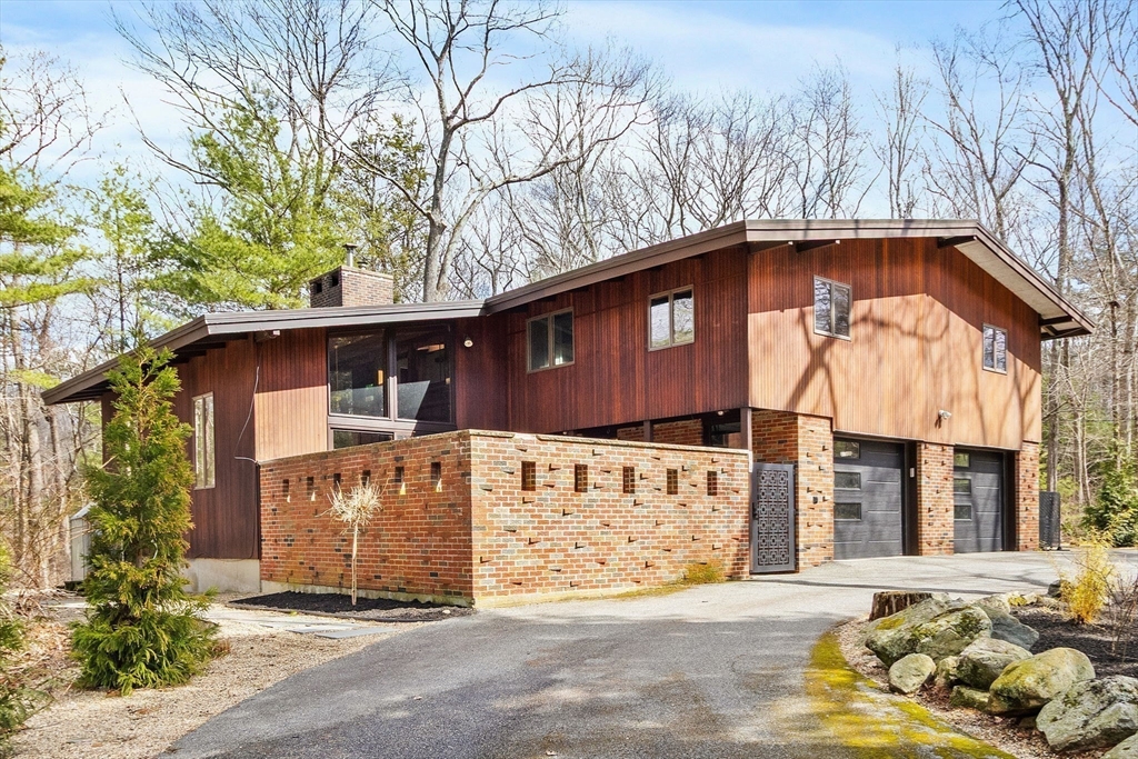 33 Turning Mill Road Lexington, MA 02420 - Photo 40 of 42 a front view of a house with a yard