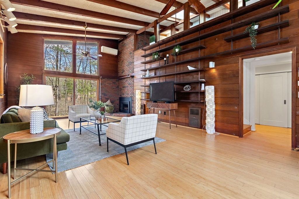 33 Turning Mill Road Lexington, MA 02420 - Photo 5 of 42 a living room with furniture and a wooden floor